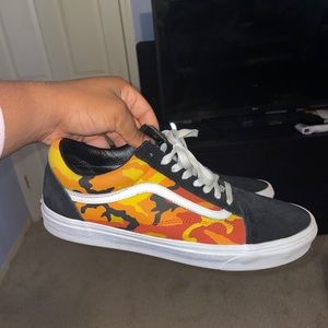 Red, orange, and black camo vans